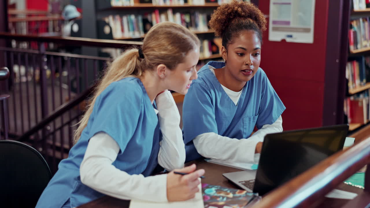 Nursing students studying in the library