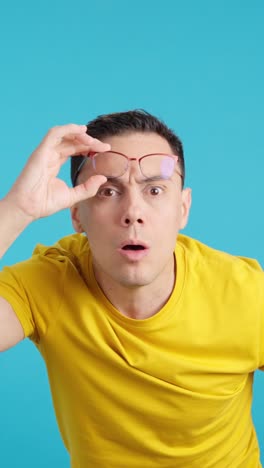 man wearing eyeglasses expressing surprise