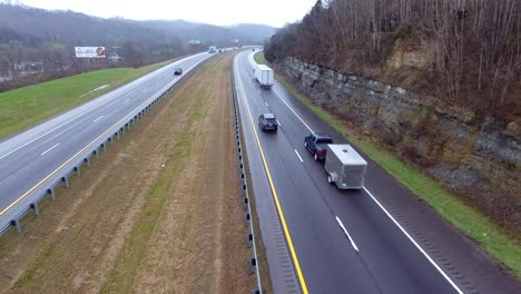 4k aerial freeway cable cam right trucks transportation vehicles driving on tennessee road