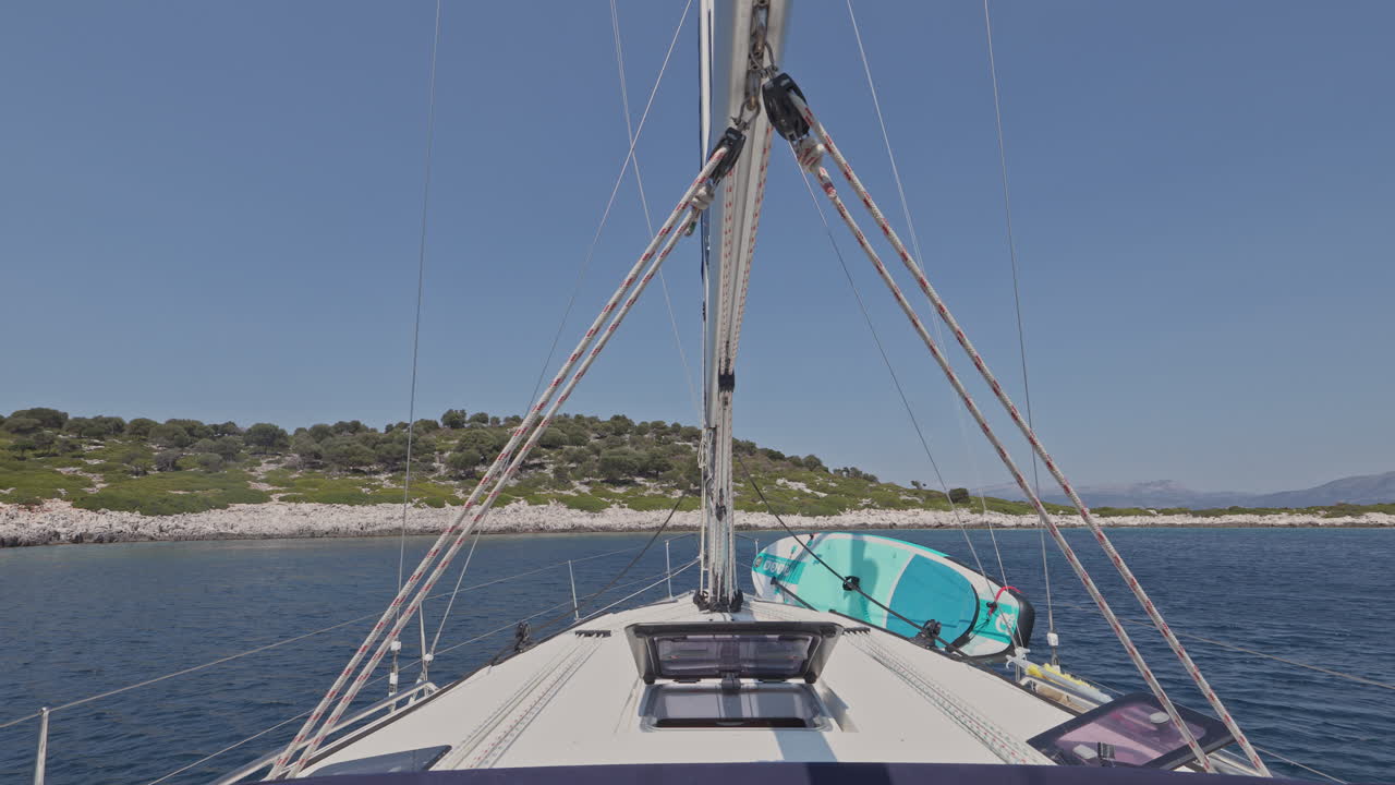 view from a yacht of a greek island at sunrise