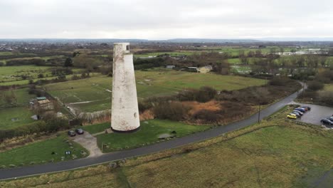 historic leasowe lighthouse maritime beacon landmark aerial coastal countryside wirral view slow pull away