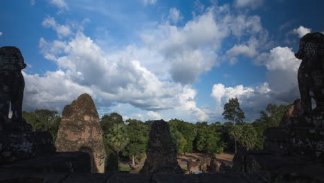 angkor temple guardian lions overlook sacred lands at the onset of monsoon season