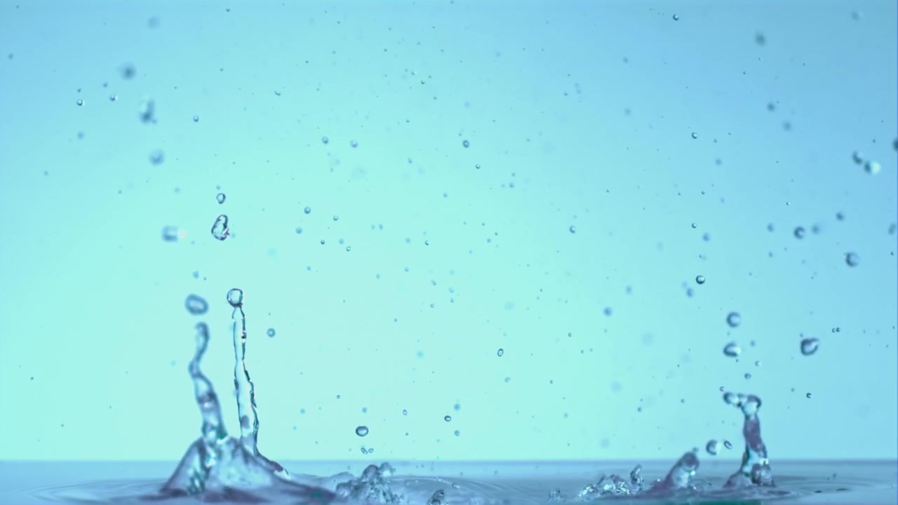 Dynamic Water Splashes in Slow Motion on Blue Background