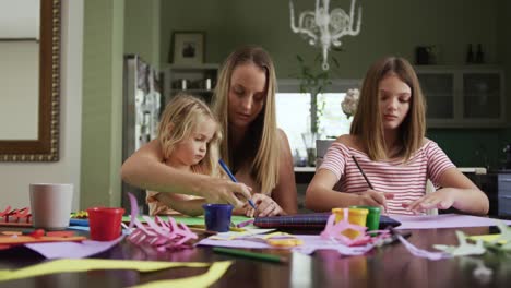 Mother-and-daughters-painting-together