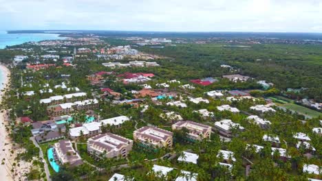 An-aerial-drone-shot-of-the-Dominican-Republic-beachfront-with-multiple-resorts-visible