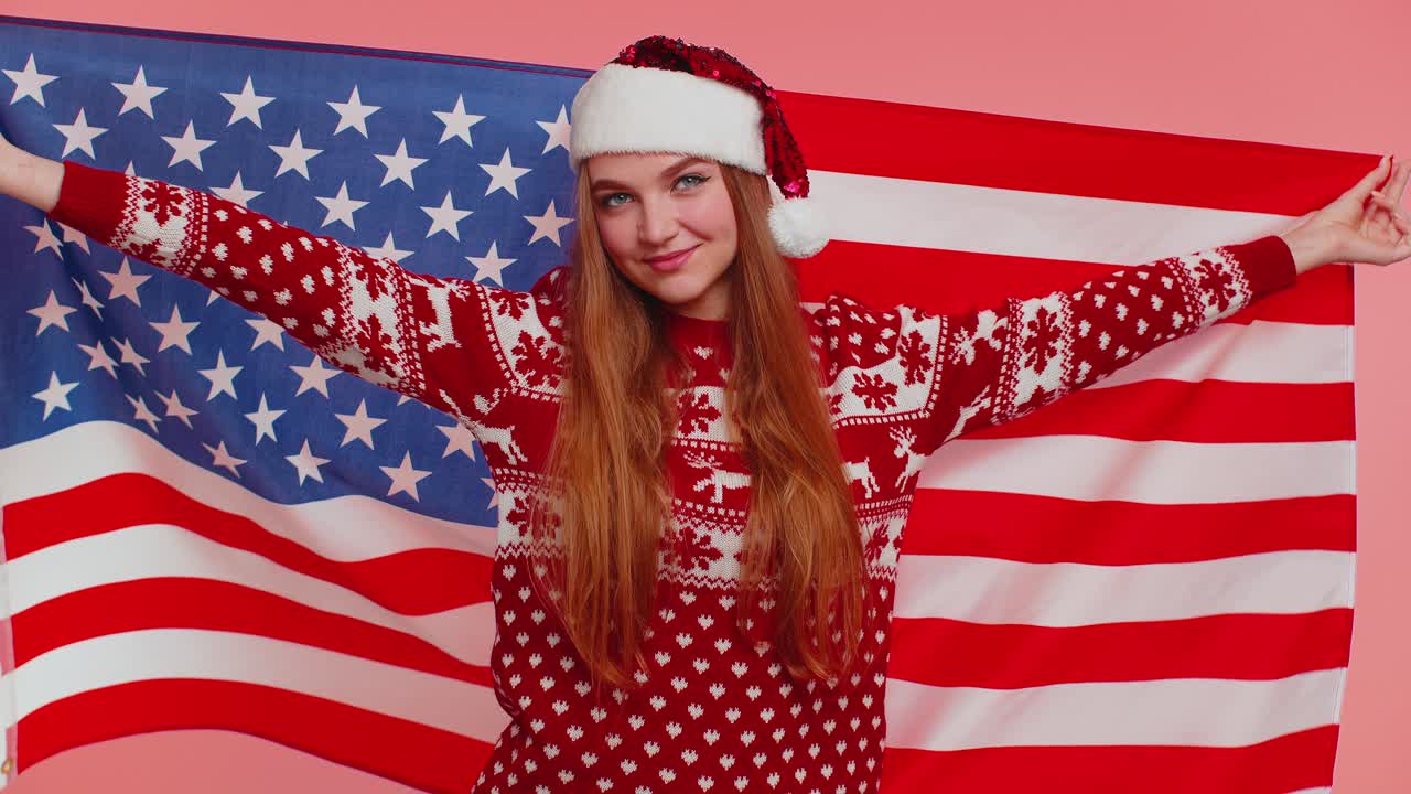 Christmas adult girl waving and wrapping in american flag celebrating human rights and freedoms