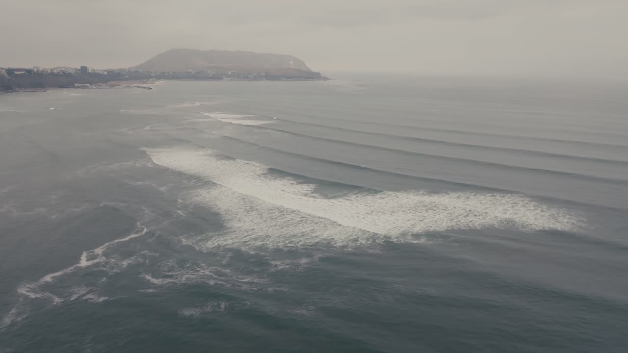 Ocean Waves Rolling In A Beach In Peru On A Cloudy Day - Aerial Shot