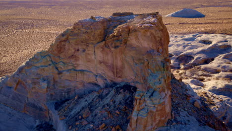 a sweeping drone shot circles the breathtaking eroded rock formations of glen canyon and lake powell near page, arizona.