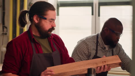 woodworking expert doing quality assurance on timber block