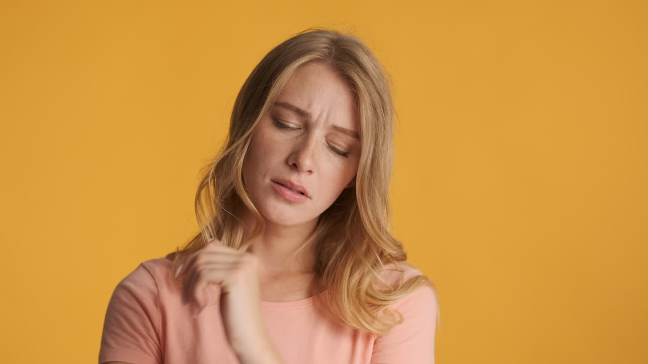 Caucasian woman looking doubtful on camera.