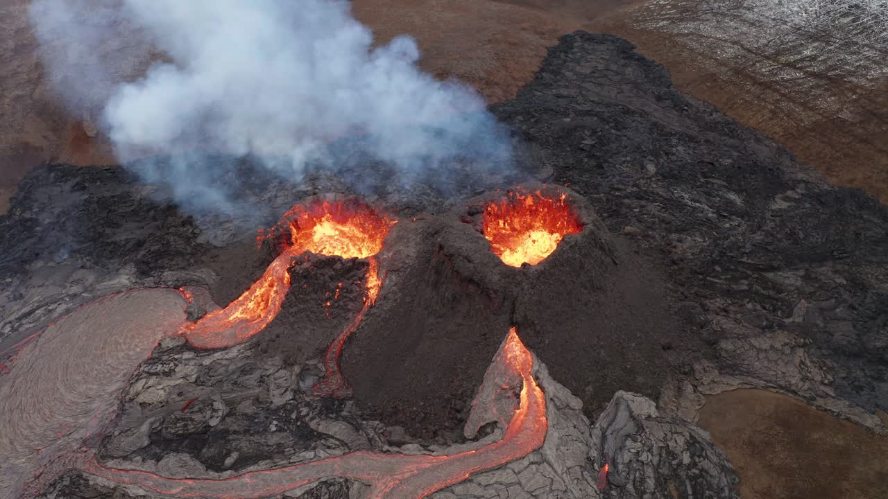Volcano Crater Eruption With Flowing Lava And Smoke - Fagradalsfjall Volcano Eruption In Reykjanes Peninsula, South Iceland - aerial orbit