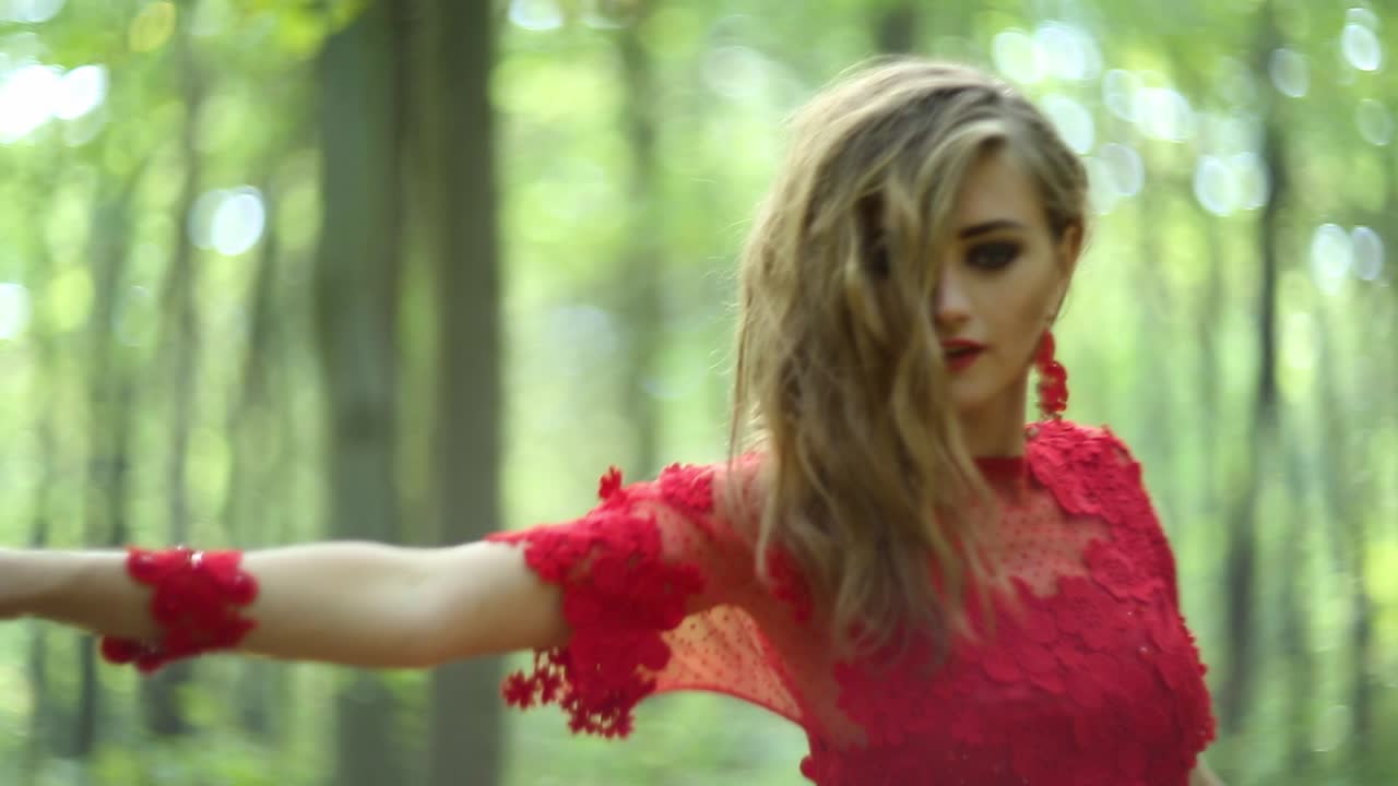 Romantic Stylish Girl In The Forest. Romantic stylish girl in long red dress in the forest