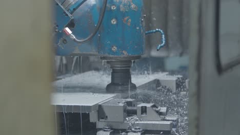 a detailed close-up showcases the cutting-edge technology of a metal milling machine at work in a bustling factory, exemplifying the high-tech precision machinery industry