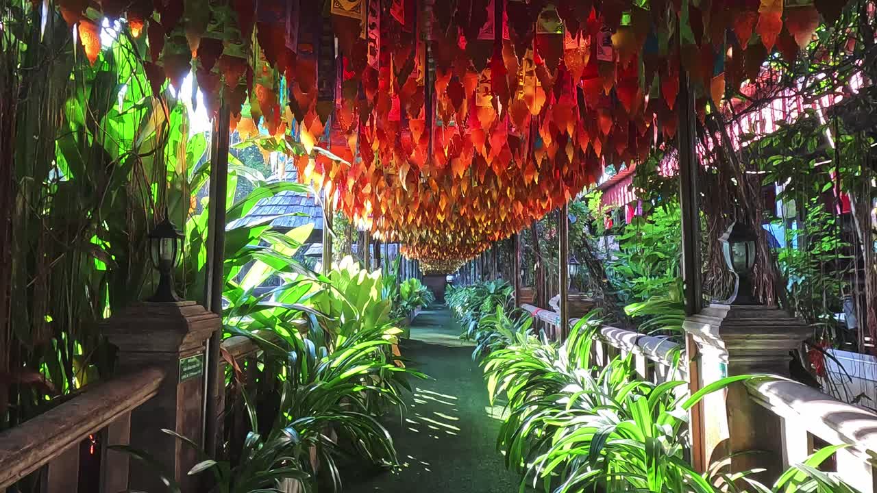 Stable shot of a corridor filled with colorful religious flags, traditional decoration during the Songkran Festival or Thai New Year