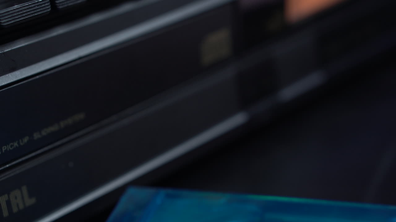 Loading CD in Compact Disk Player and Starting Music Playback, Close Up