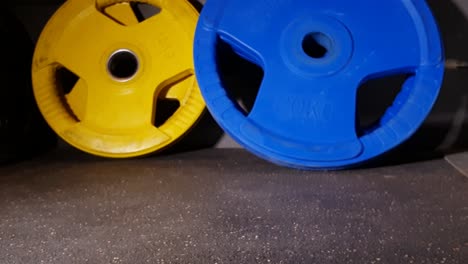 close up of medicine ball and gym weights grabbed