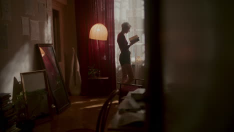 woman reading in a vintage apartment