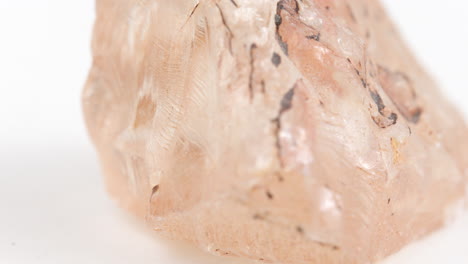 macro shot of abstract pink colour like rock spinning around showing rough texture on surface