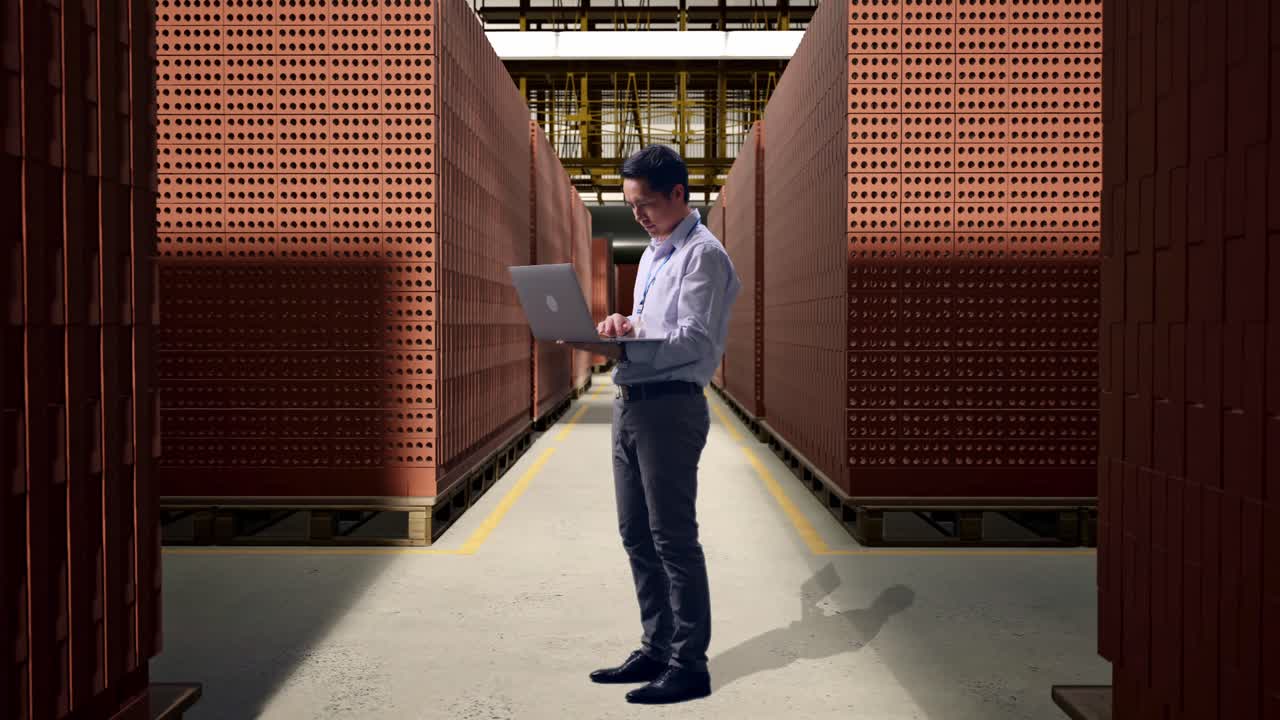 Business Person Inspecting Brick Inventory in a Warehouse