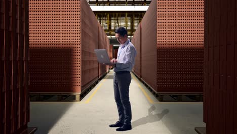 business person inspecting brick inventory in a warehouse