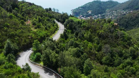 Mediterranean-mountain-landscape-with-sunny-coastal-town-in-valley,-drone-aerial