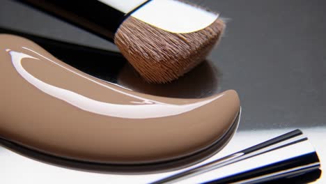 close-up of foundation and makeup brush