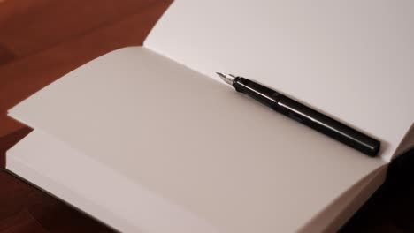 graceful writing ritual: slow motion spin of notebook and fountain pen
