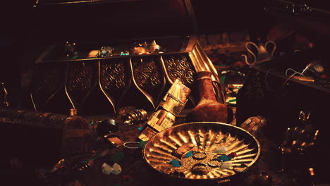 treasures in a dark cave with coins diamonds and gold