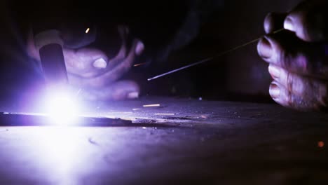 Close-up-of-welder-using-welding-torch