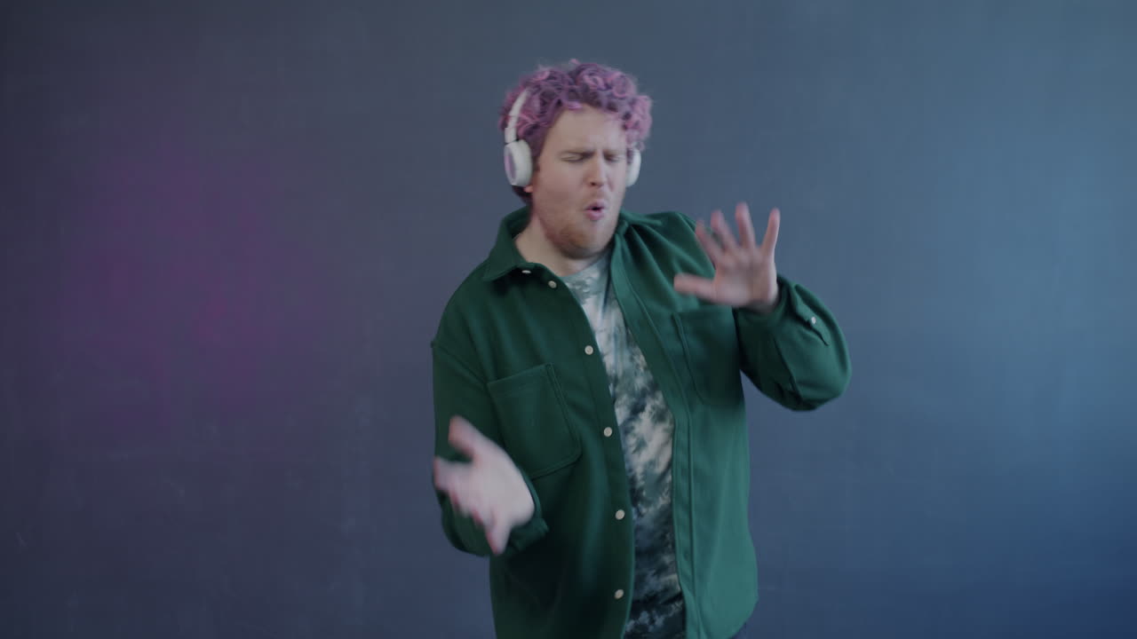 Man Dancing to Music with Headphones