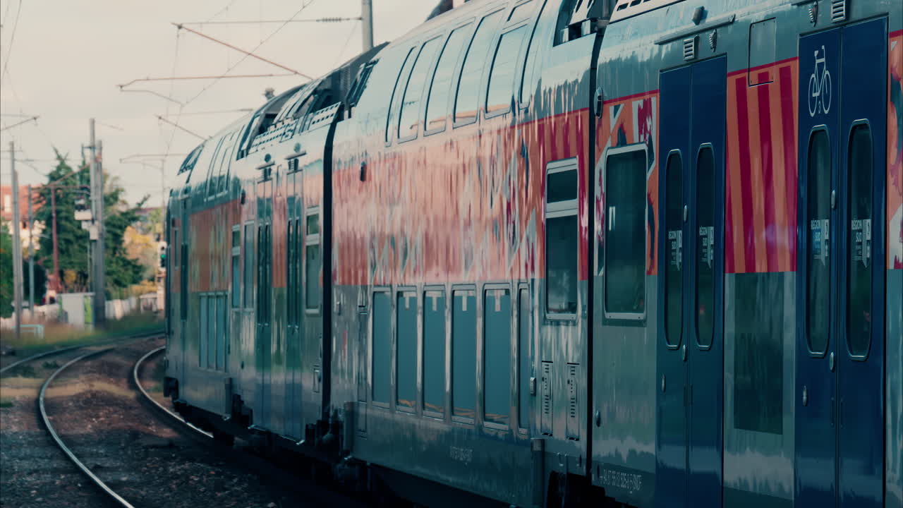 Close up of a train moving on the rails near a station in Nice, France