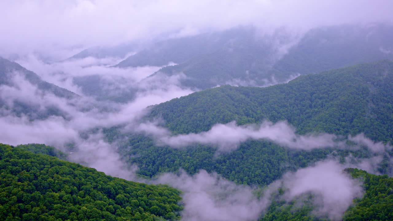 Misty veil stretches across the Smokies in this elevated drone perspective