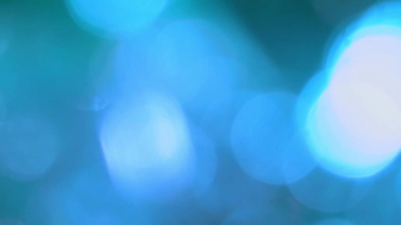 Myke, ufokuserte bokeh-lys med grønn og blå fargeovergang