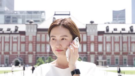 a woman talking on a smartphone