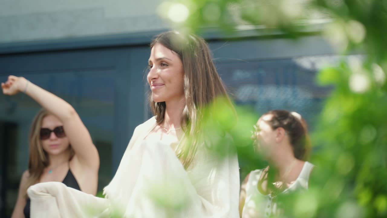 Beautiful Women are dancing in light clothes during summer