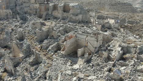 Dramatic-aerial-view-of-a-village-bombed,-destroyed-and-abandoned-during-the-Spanish-Civil-War-1936-39