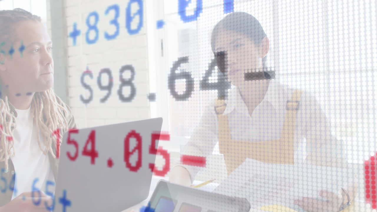 In office, animation overlaying financial data on laptops with professionals working
