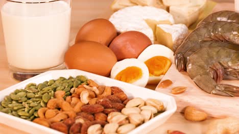 variety of protein sources on wooden background