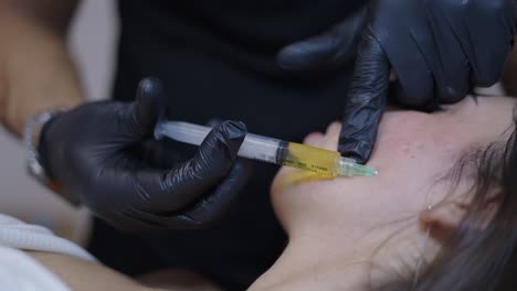 close-up of a facial injection during a cosmetic procedure