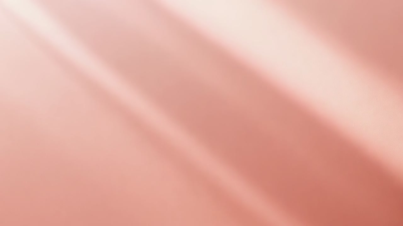 Shifting blurred pink surface drifting across lens from finger near lens, showing diagonal streaks
