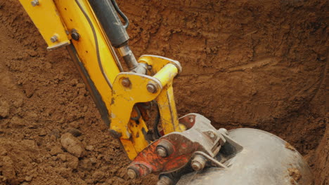 Excavator-Bucket-Digs-A-Hole-For-Communications