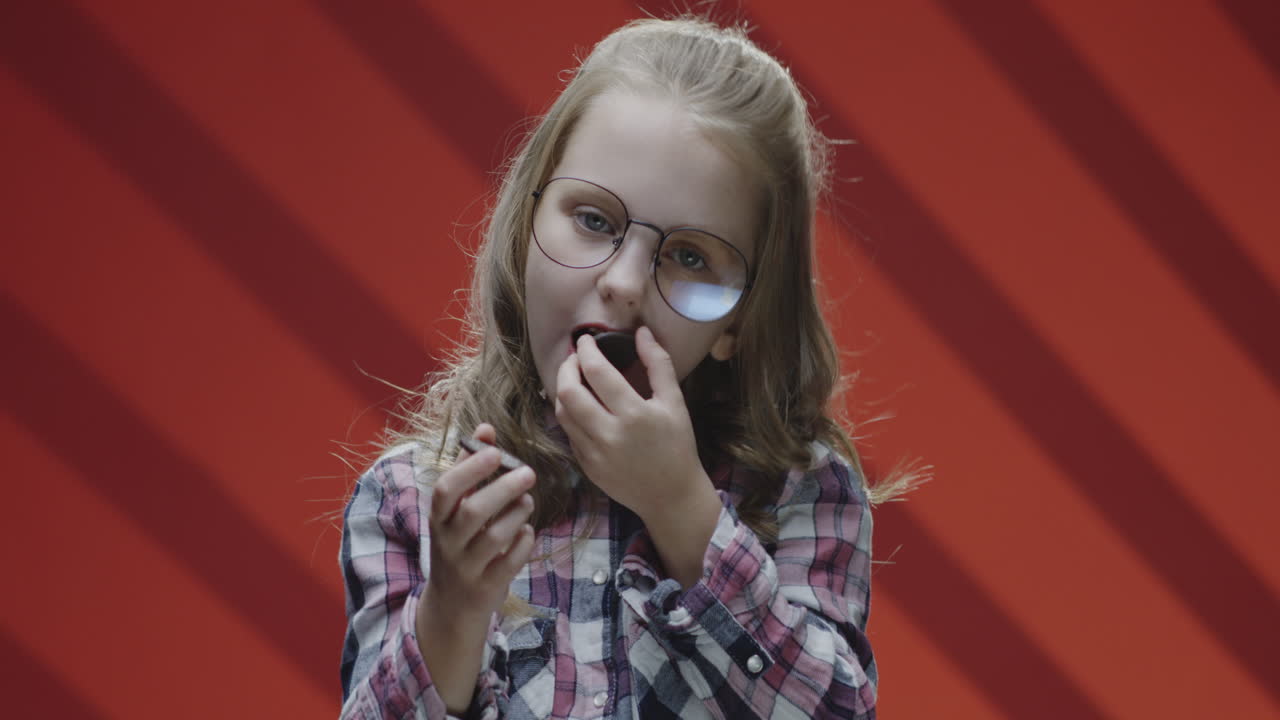 Girl Applying Lipstick