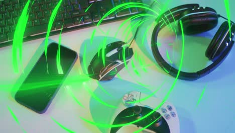 Animation-of-green-neon-tunnel-over-video-game-computer-equipment