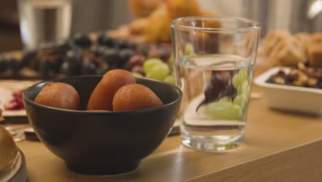 close up of food on muslim family table in home set for meal celebrating eid 12