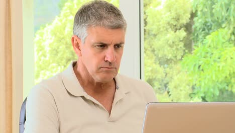 Man-working-on-his-laptop