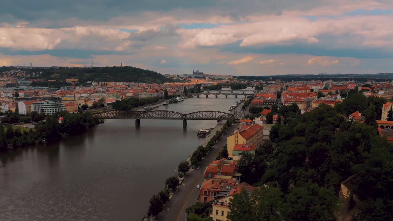 Flying over Charles Bridge and Vltava River In Prague, Czech Republic, next to vysehrad fortress - aerial drone