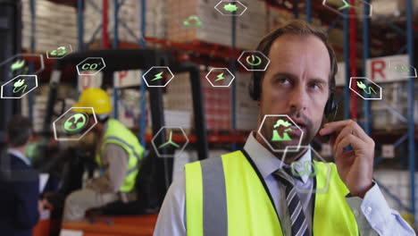 animation of data processing over caucasian man using phone in warehouse