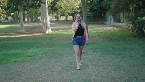 woman talking on phone in a park