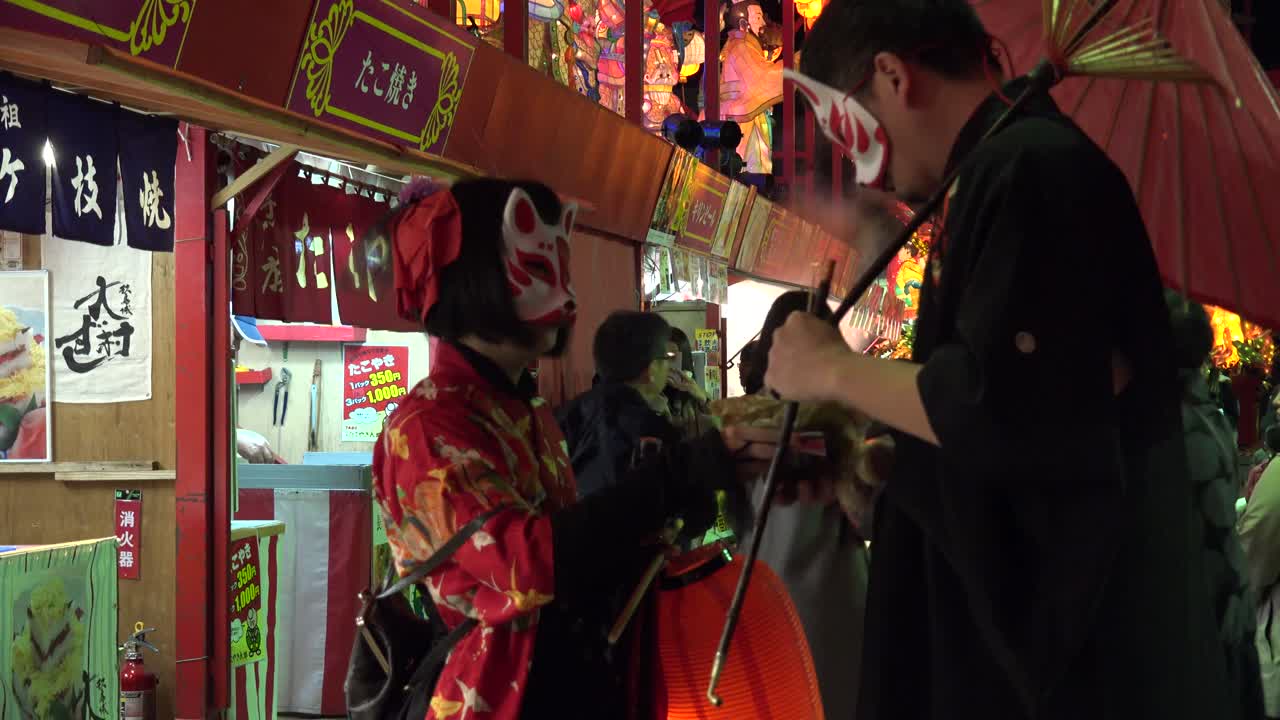 Vibrant Japanese Night Festival with Traditional Kitsune Masks and Street Food Stalls