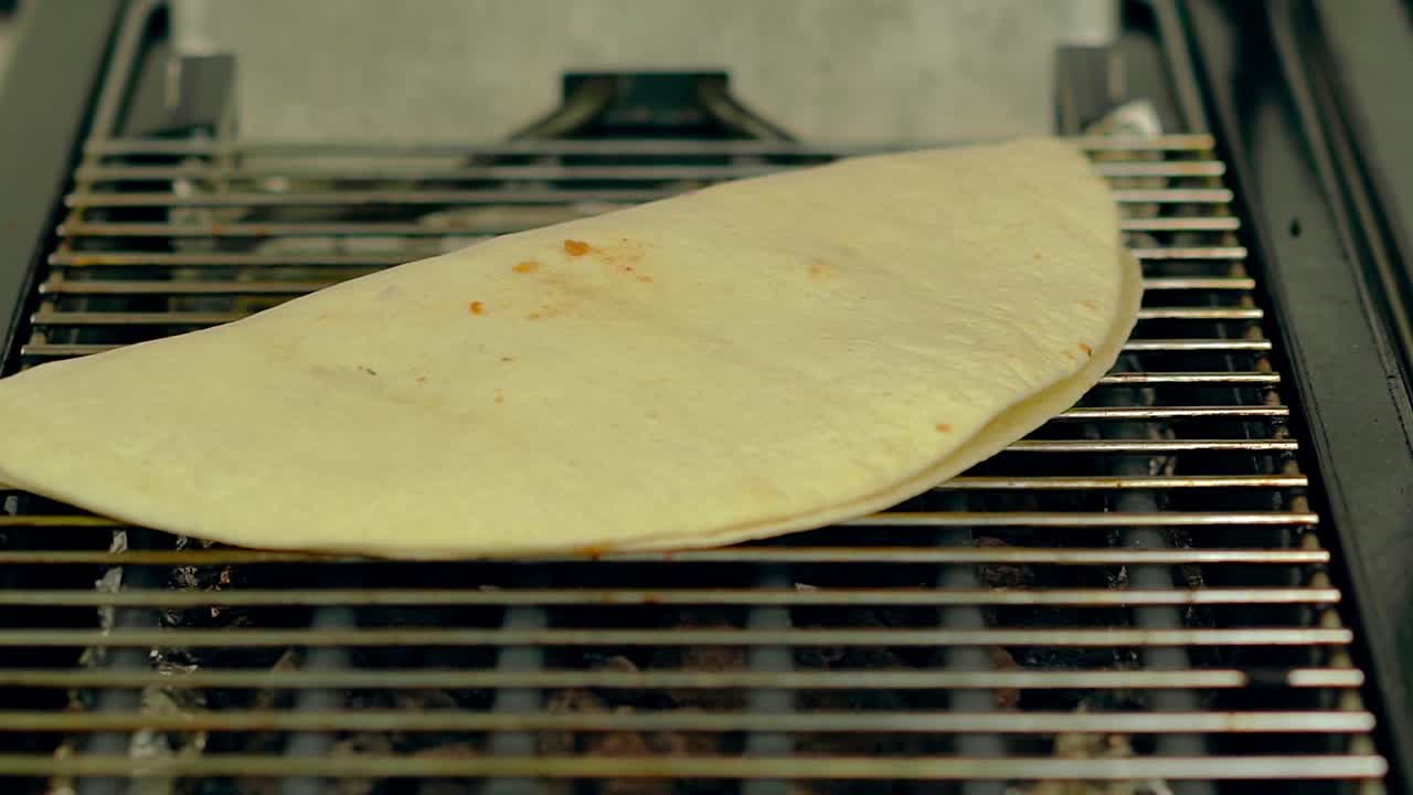 CU Slow motion Cook prepares the wok puts it on the grill